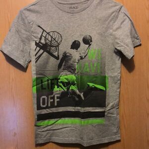Place size large 10/12 boys Tshirt We have lift off basketball